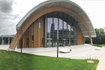 Slough Ice Arena. Accoya - 15mm vertical cladding.  Profiles: 15mm x 42mm, 15mm x 92mm & 15mm x 142mm PAR Eased edges. Colour  Tri-Colour system: Sikkens E5.58.44T Light Oak; Sikkens D5.51.29T Teak (Medium Oak); Sikkens D9.54.32T Dark Oak.