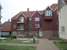 Project: Warwick Gates Care Village. Profile:  ex 200mm Rebated Bevel. Colour: New Pilgrim Red CCS70040